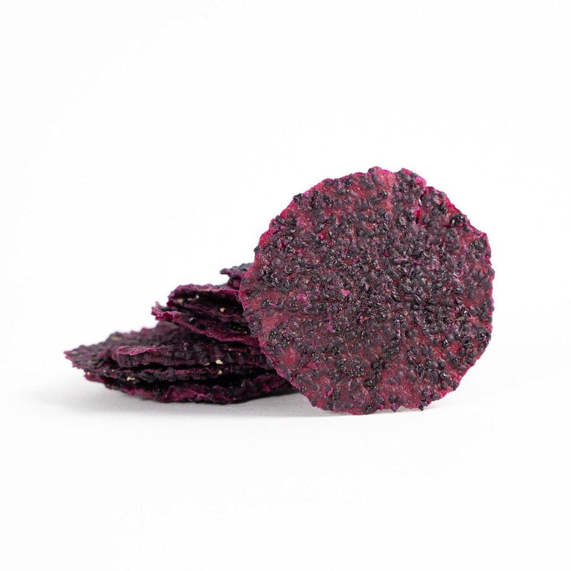 Dehydrated red dragon fruit used as exotic and tropical cocktail garnishes