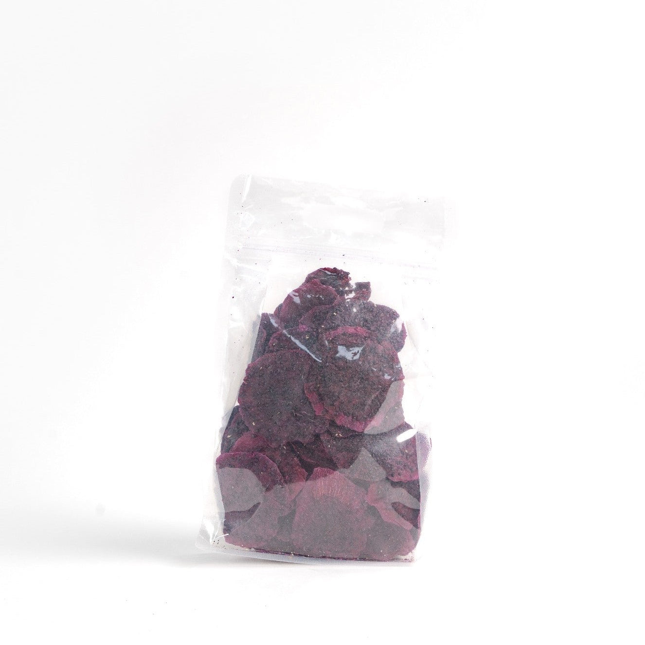 Dried red dragon fruit garnish in a bag