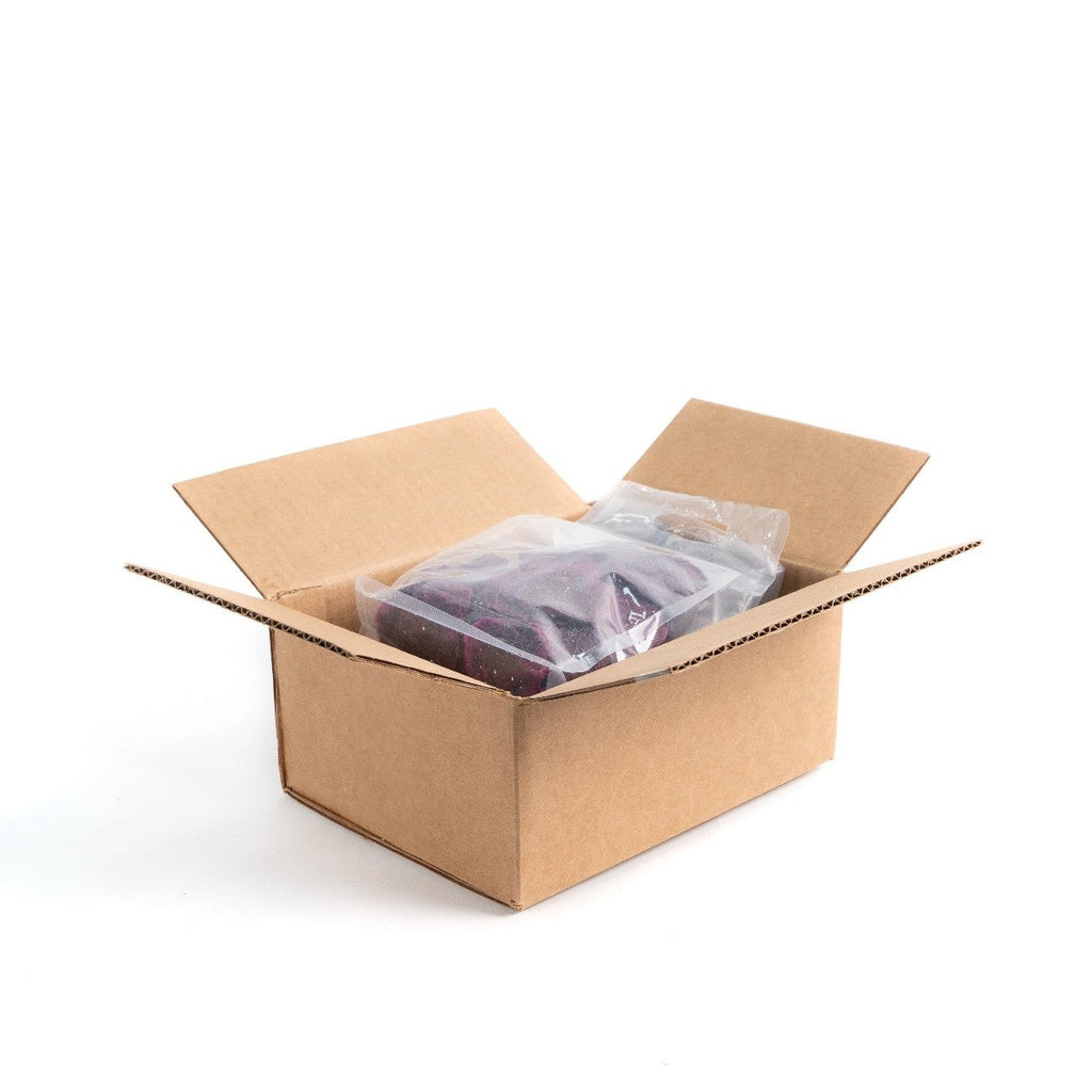 Dried red dragon fruit wheels in a box